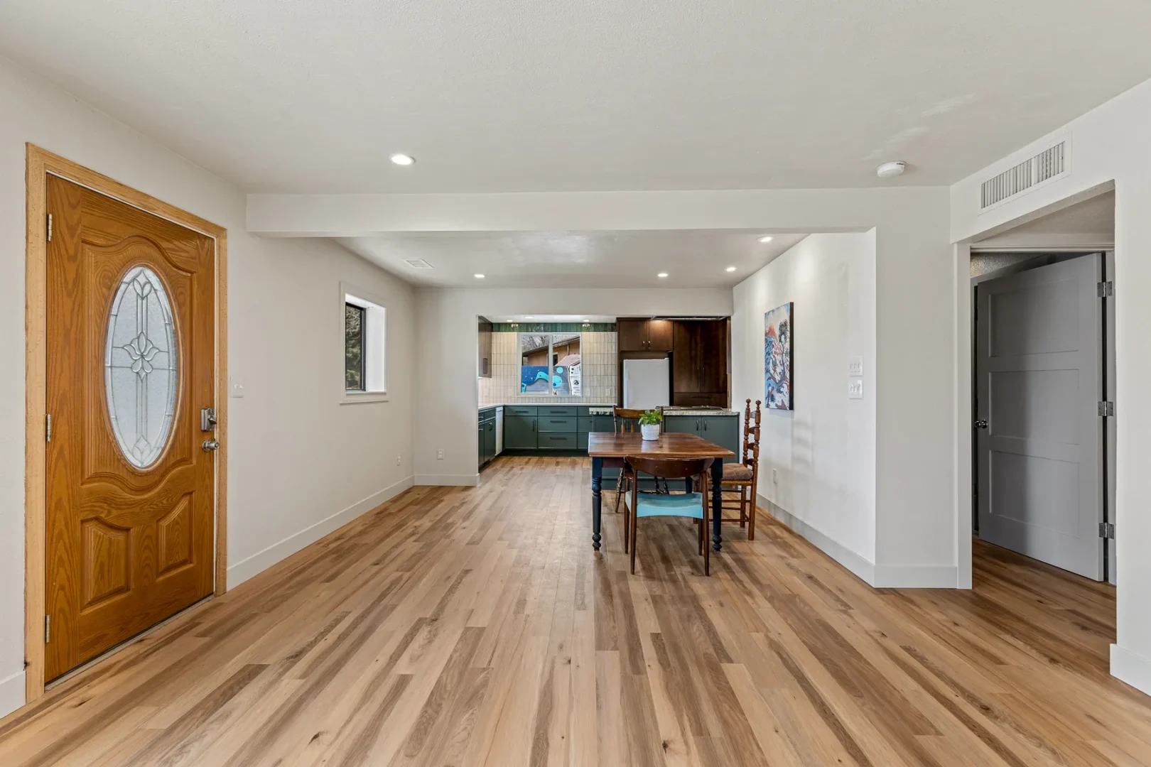 Open concept living area from home addition in Central Flagstaff AZ with hardwood floors by Barden Home Builders